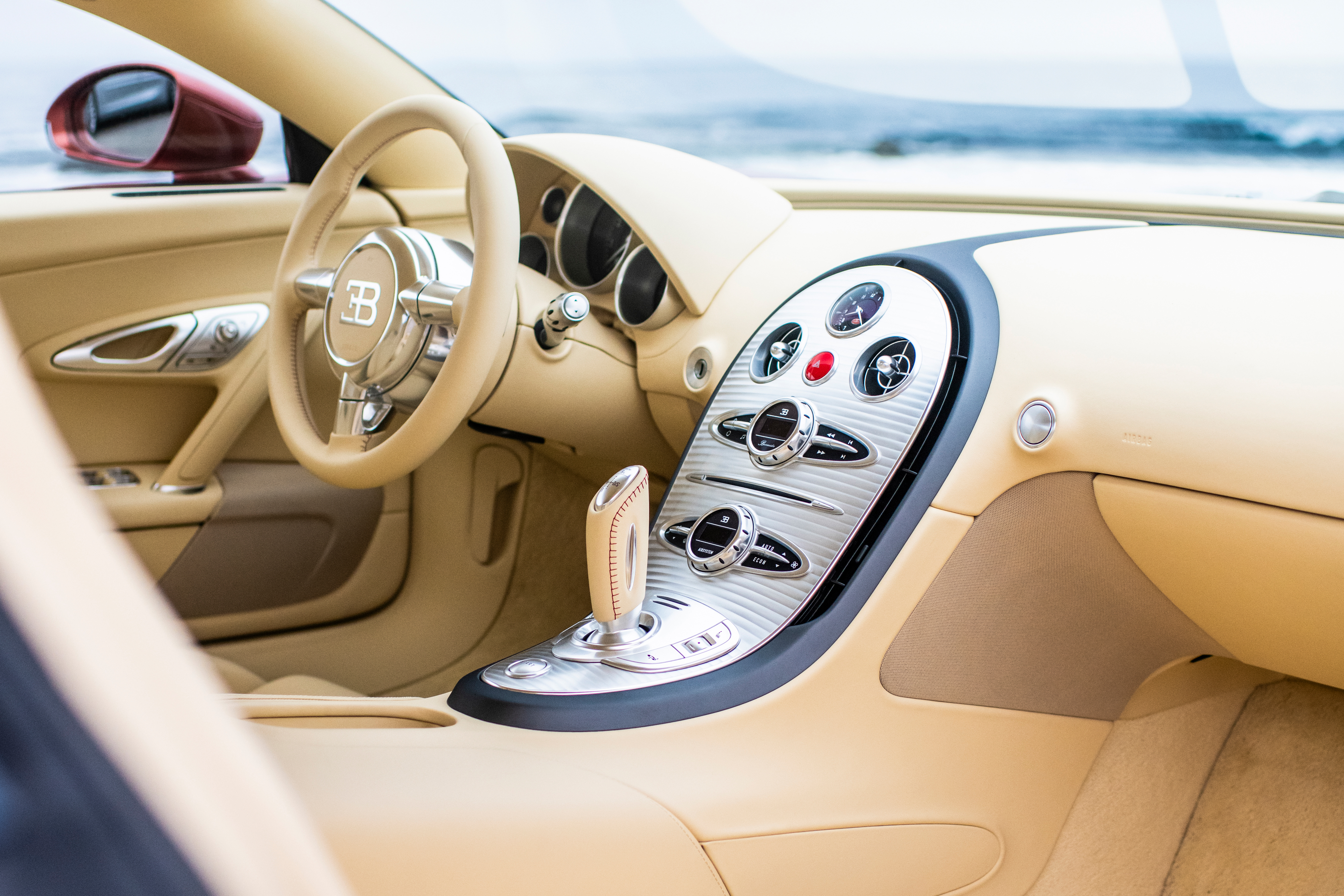 In a mesmerizing display of craftsmanship, a Côte de Genève finish inspired by the precision of fine watchmaking adorns the center console. 